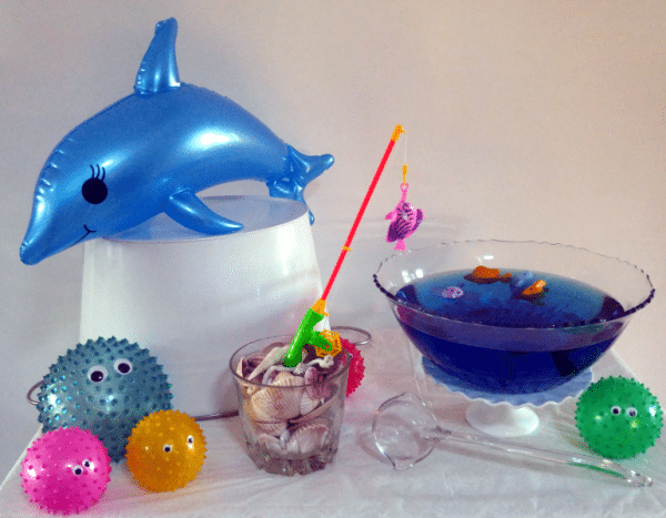 Fishing hole punch bowl with shells and fishing rod at sea party