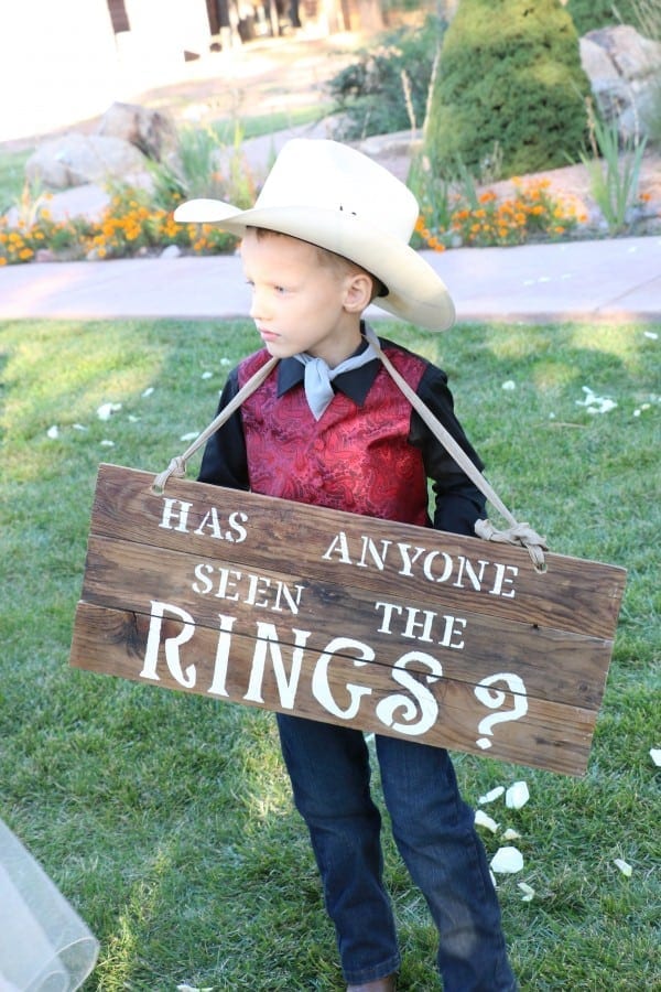 Ring Bearer holding sign during ceremony.